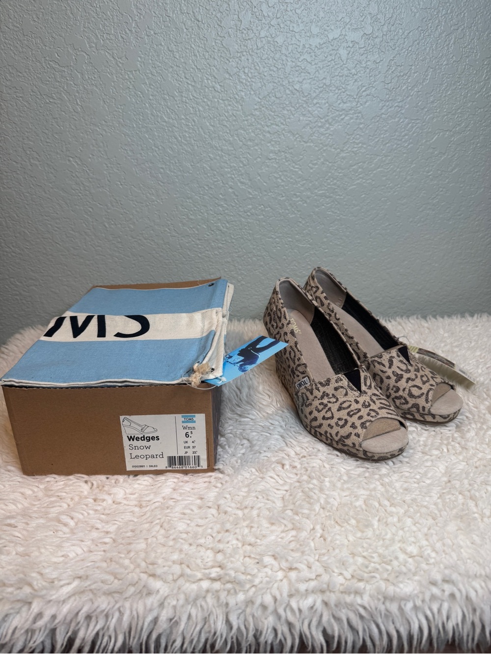 TOMS Snow Leopard print peep-toe wedge heels in women’s size 6.5. NWT